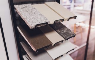 Display of quartz, granite, and marble countertops in AMC Stone and Cabinets Colorado showroom