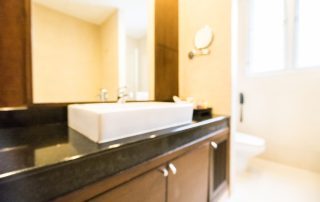 Modern Colorado bathroom remodel with custom cabinets and quartz countertops