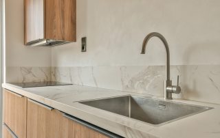 Durable kitchen countertops designed for a busy Colorado household by AMC Stone and Cabinets